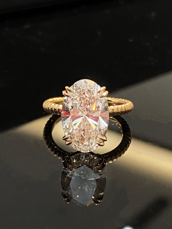 Elegant Twist & Shine Oval Diamond Ring