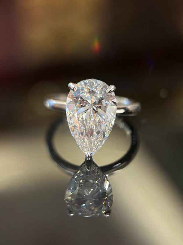 Elegant 5Carat Teardrop Diamond Ring with Side Stones