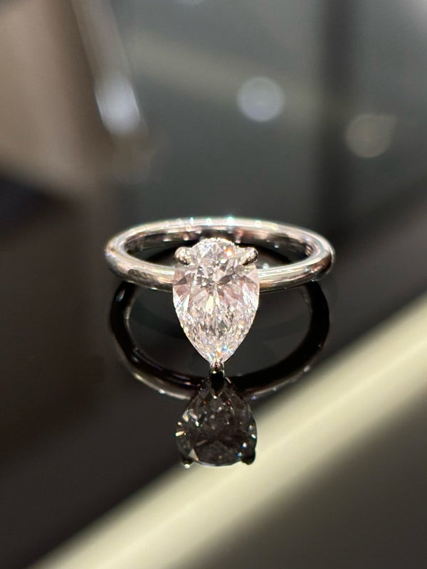 Luxurious Teardrop Diamond Ring with Side Stones